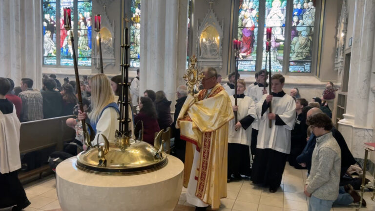 Bishop Vetter presiding over the Eucharistic Procession inside the Cathedral of St. Helena.